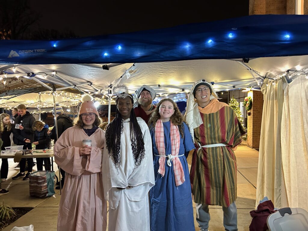 Five people dressed up for acting out the Nativity scene
