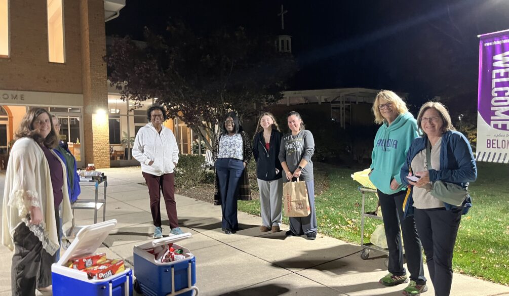 photo of women distributing free dinners to families