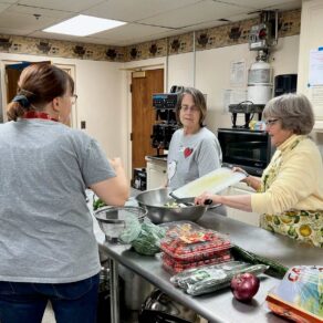 Hypothermia Shelter Cooking Women cooking in church kitchen