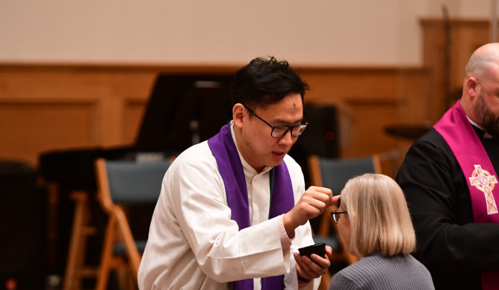 Pastor Minoo administering ashes