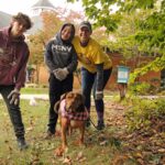 Family volunteering with dog