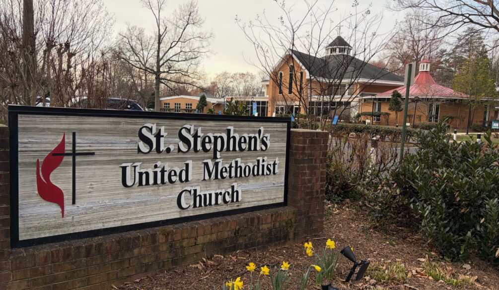Church sign and daffodils