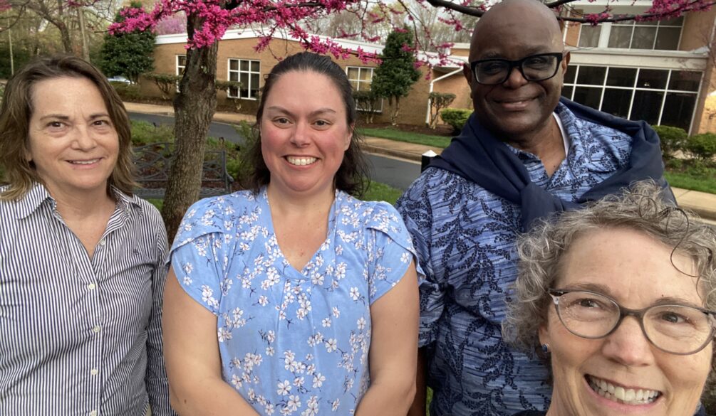 Pastor Chaney, Martha James, and two women at church
