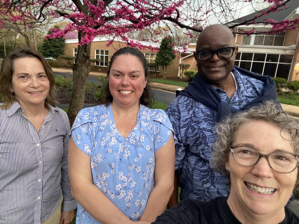 Pastor Chaney, Martha James, and two women at church