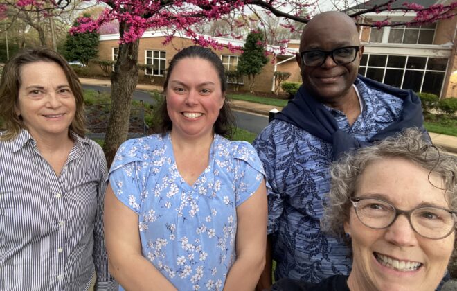 Pastor Chaney, Martha James, and two women at church