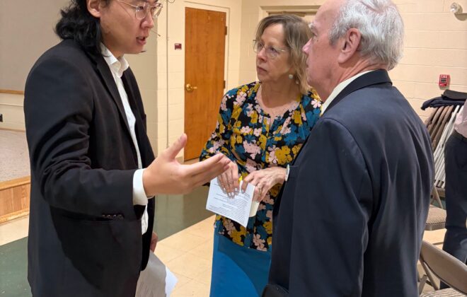 Pastor Minoo talking to people