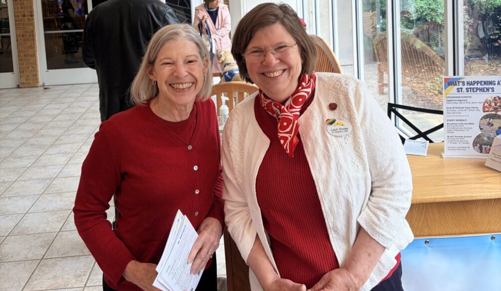 Two women at the welcome desk