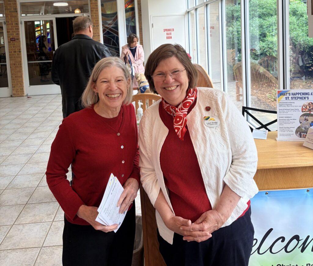 Two women at the welcome desk