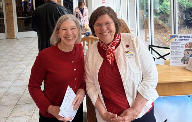 Two women at the welcome desk