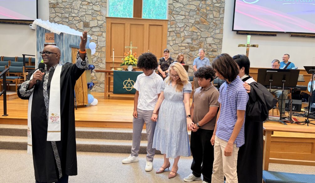 Pastors blessing those going on Youth Mission trip