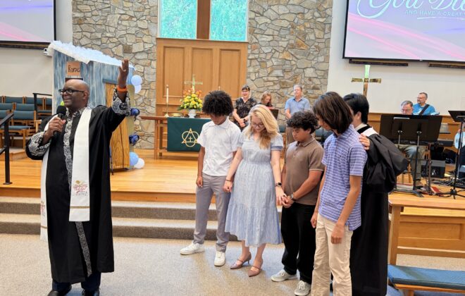 Pastors blessing those going on Youth Mission trip