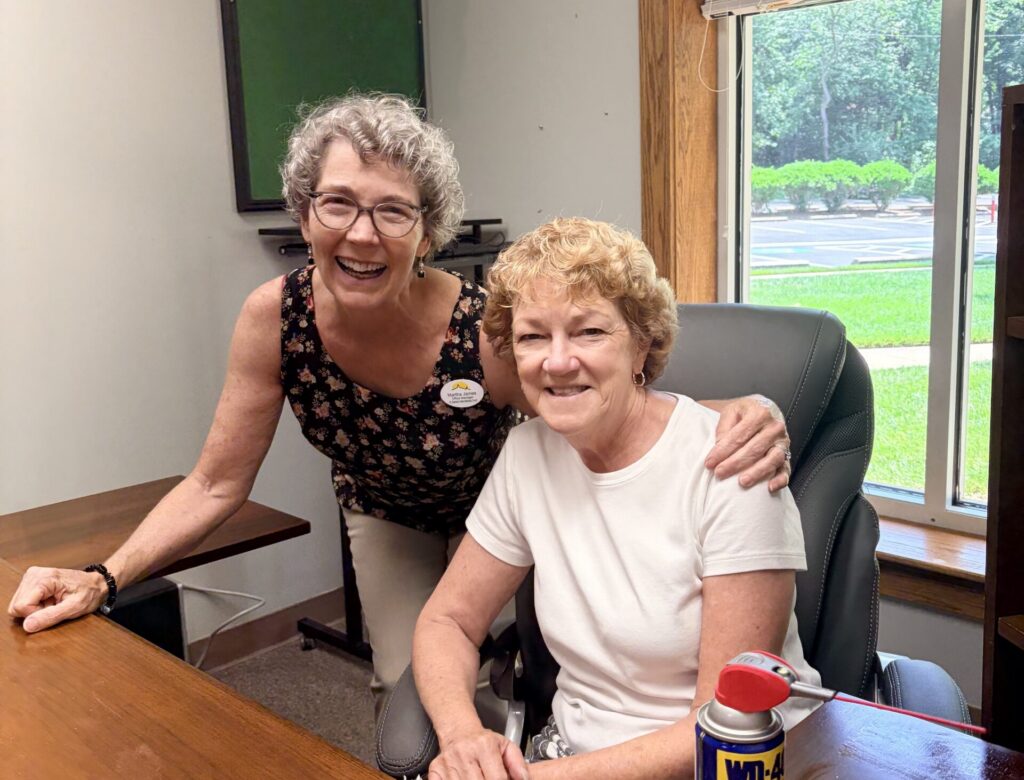 Martha and Muriel cleaning Pastor Sunu's office