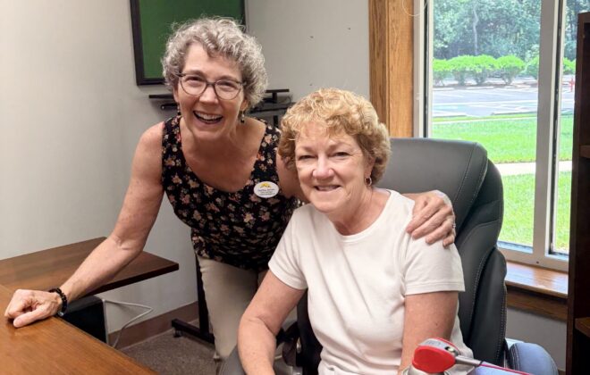 Martha and Muriel cleaning Pastor Sunu's office