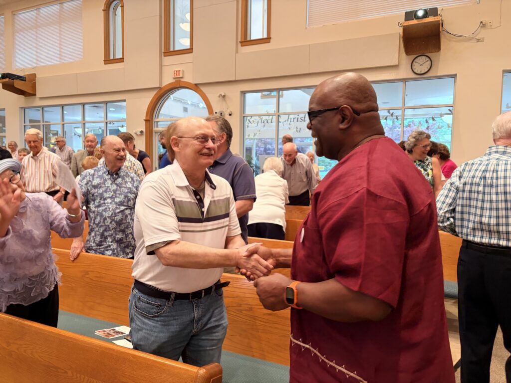 Pastor Chaney greeting parishoners